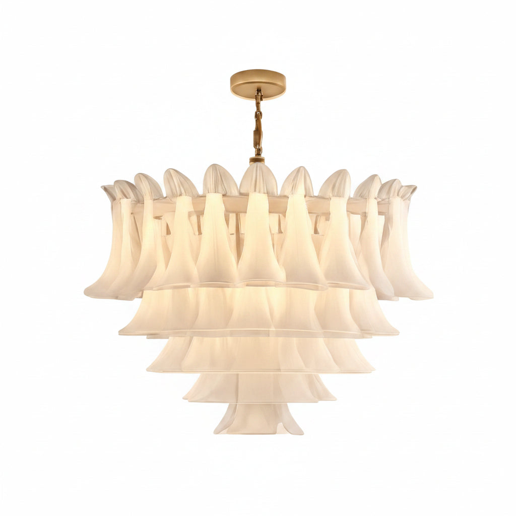Luxurious chandelier hanging in a bright room with white walls and large windows.