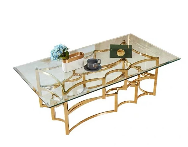 A luxurious glass coffee table with a rectangular top, featuring a clear tempered glass surface and a sleek metal frame.